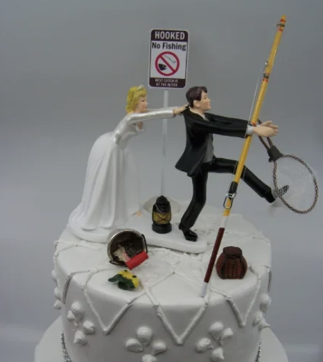 cake toppers of a groom running away