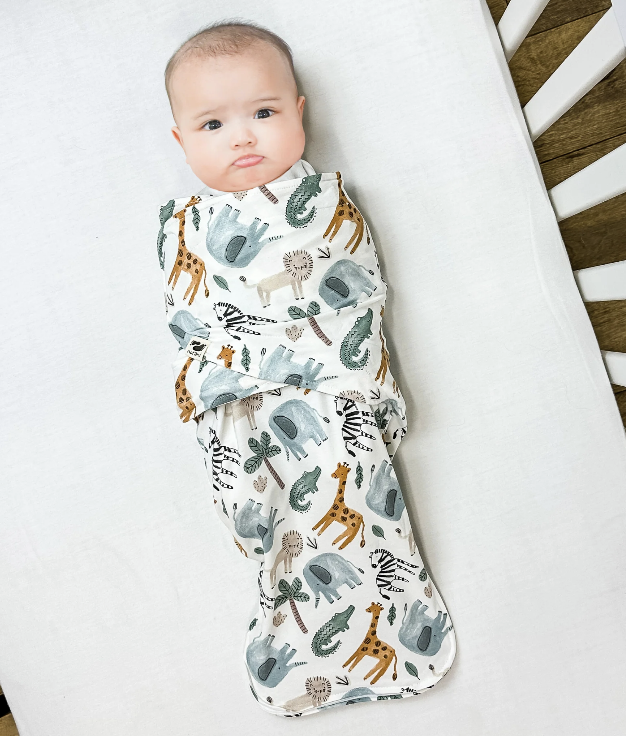 A baby swaddled up in a Norani swaddle.