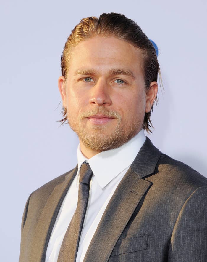 Closeup of Charlie Hunnam ina suit and tie