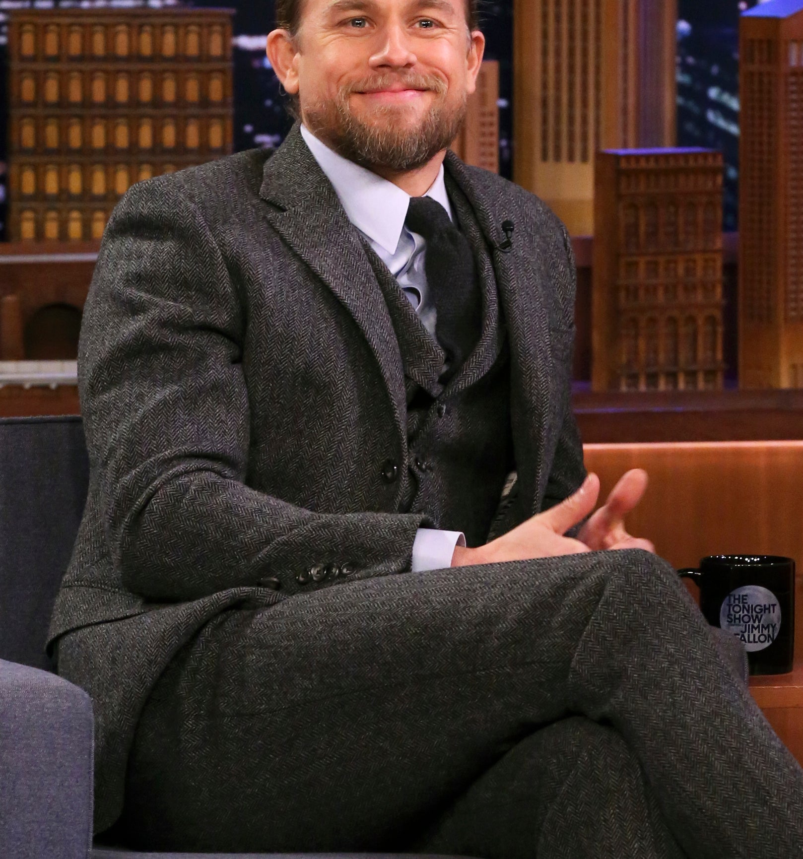 Charlie Hunnam sitting for a late night TV interview