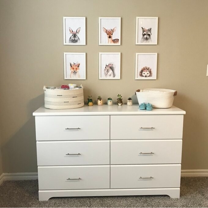 the six-drawer white dresser in baby&#x27;s bedroom