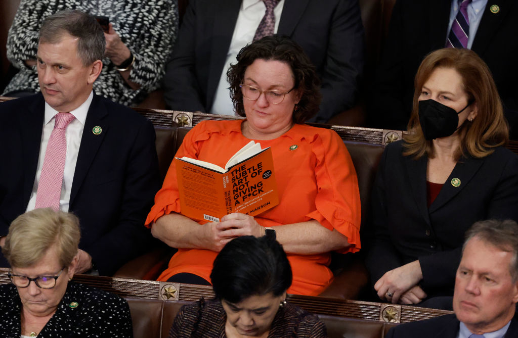 A woman reading a book in a hearing