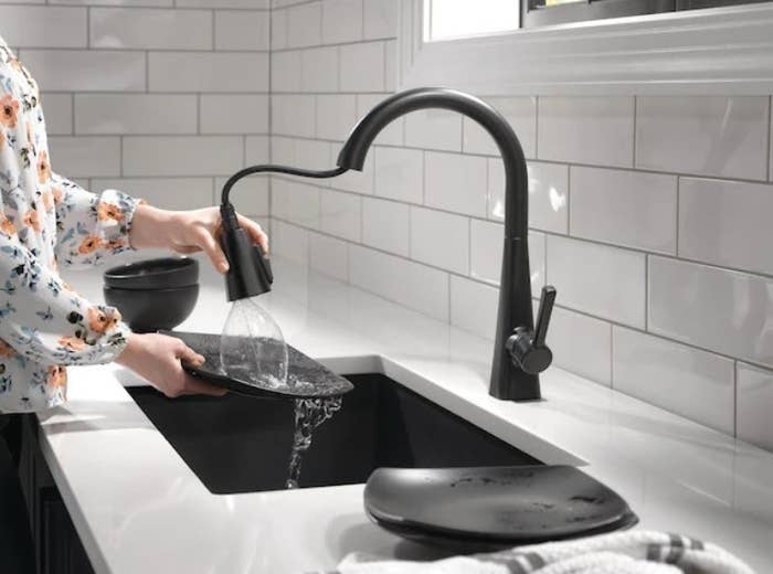 model using the black faucet
