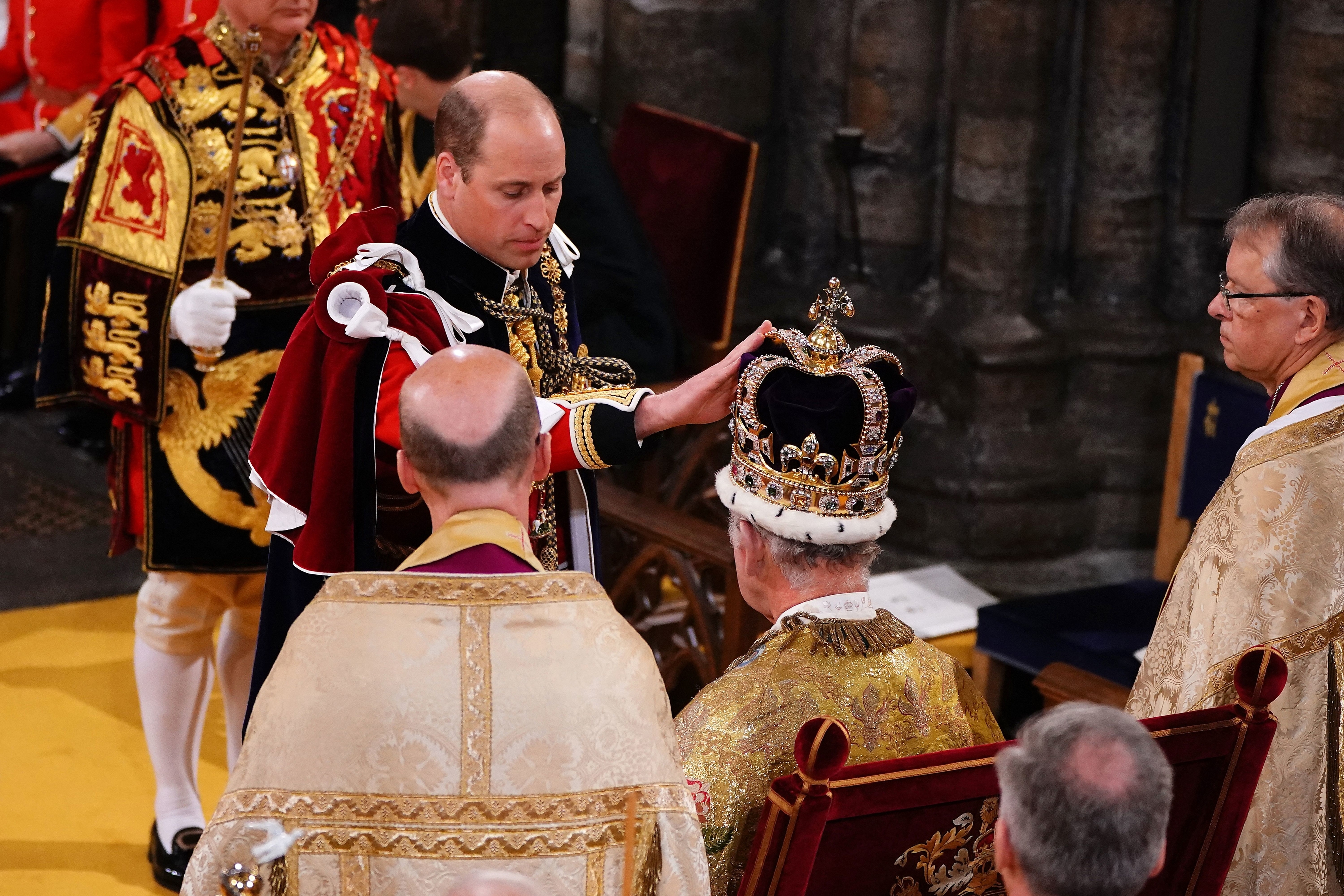 Prince William touching his father&#x27;s crown