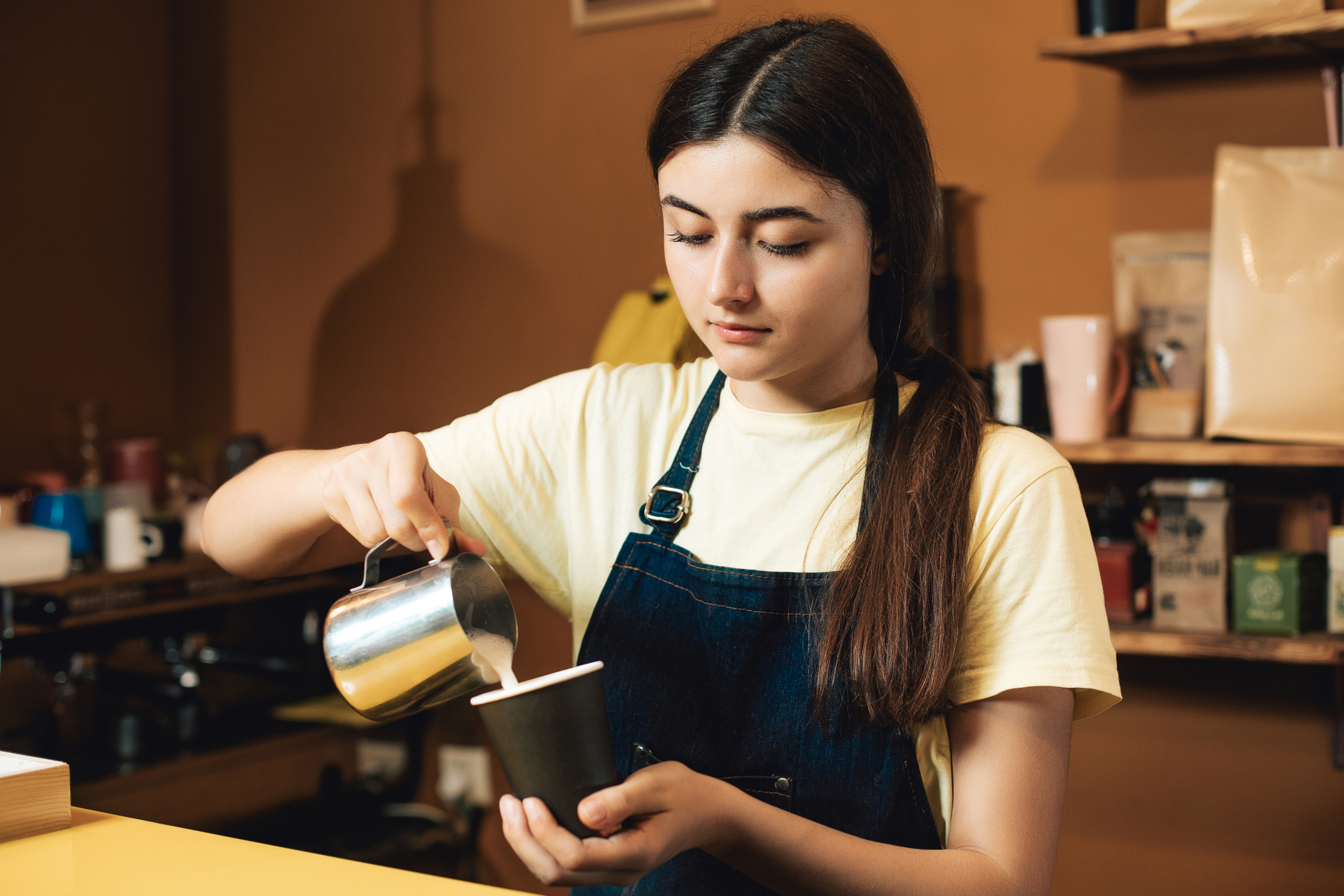 A barista working behind the counter