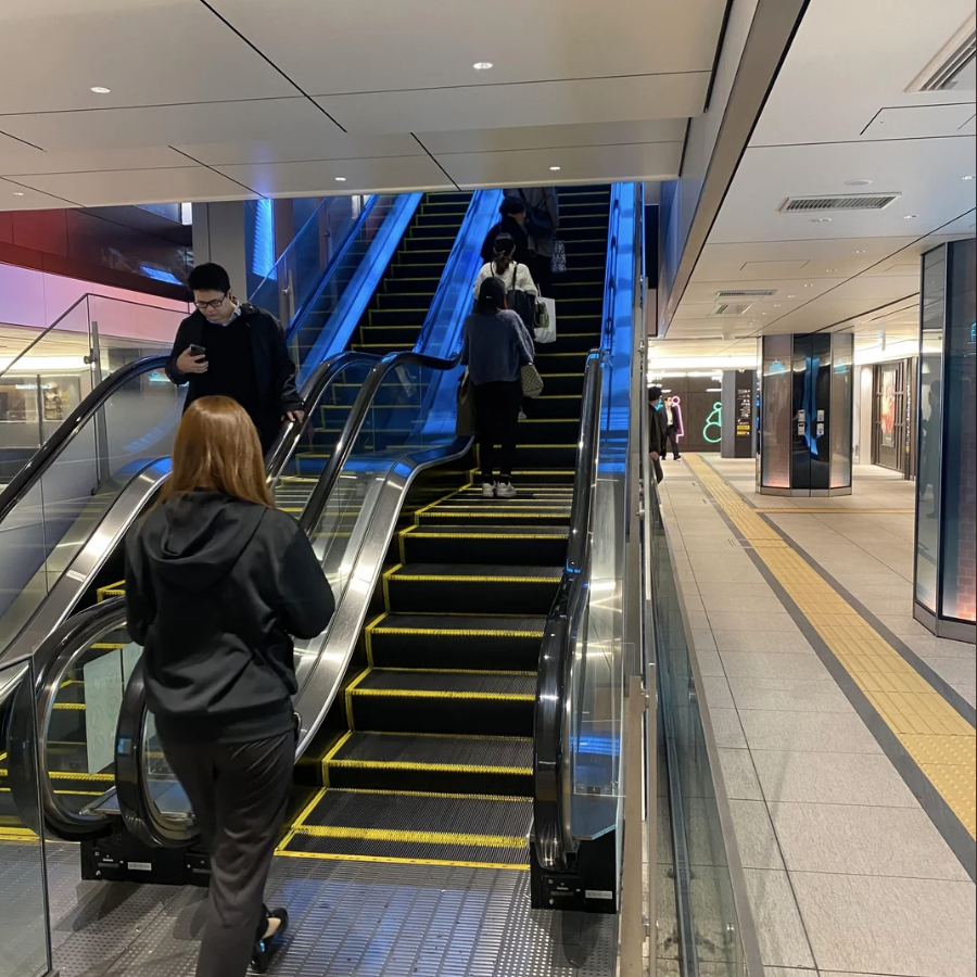 an escalator with a landing