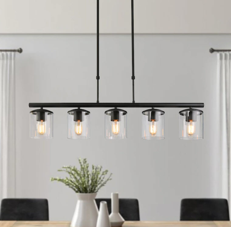 overhead pendant lighting with five bulbs over dining table