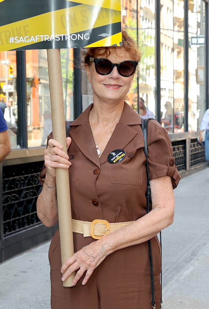 her holding up a sign during the writer's strike