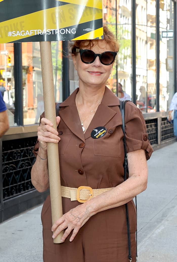 her holding up a sign during the writer&#x27;s strike