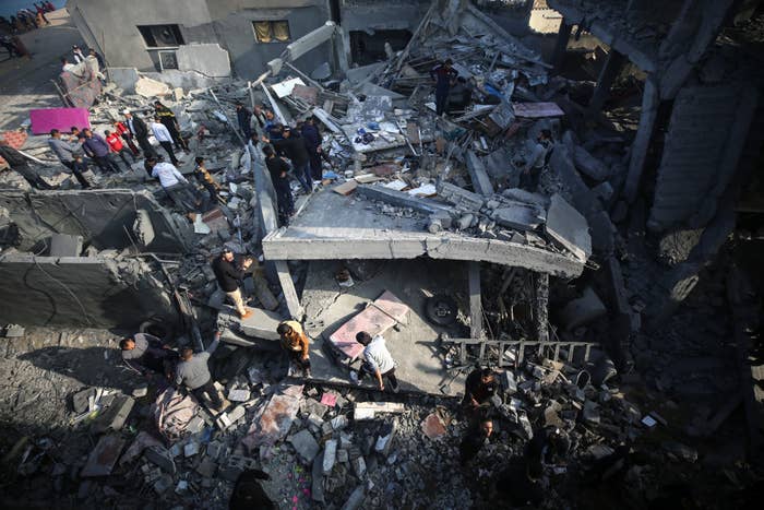 People standing in the Rubble after bombings