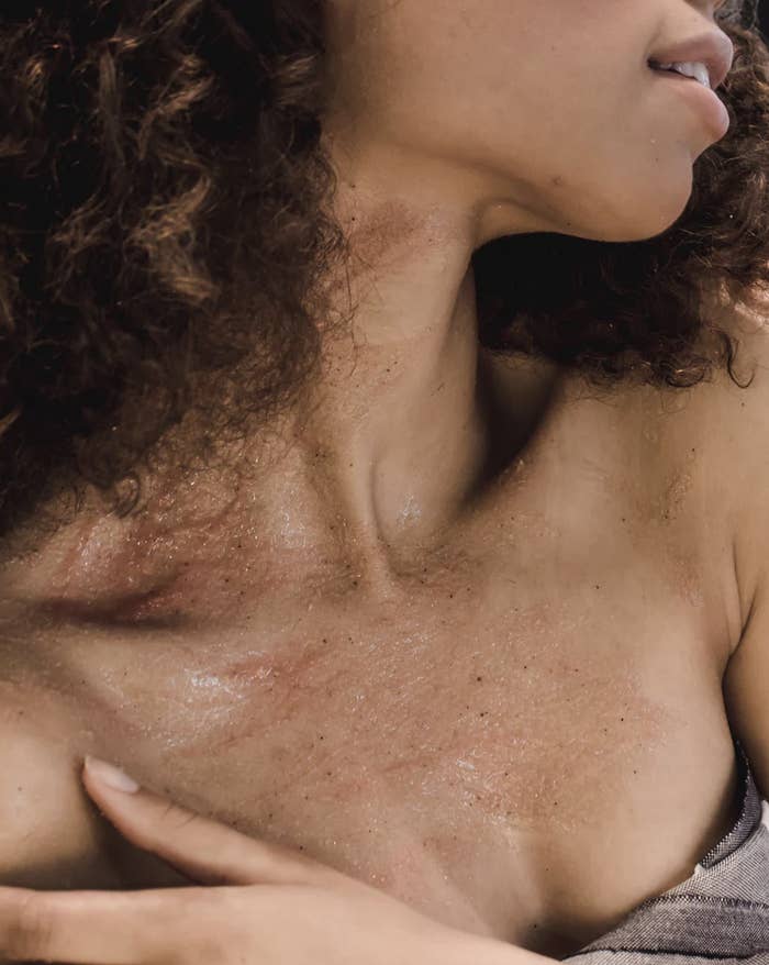 Body scrub on a woman&#x27;s chest