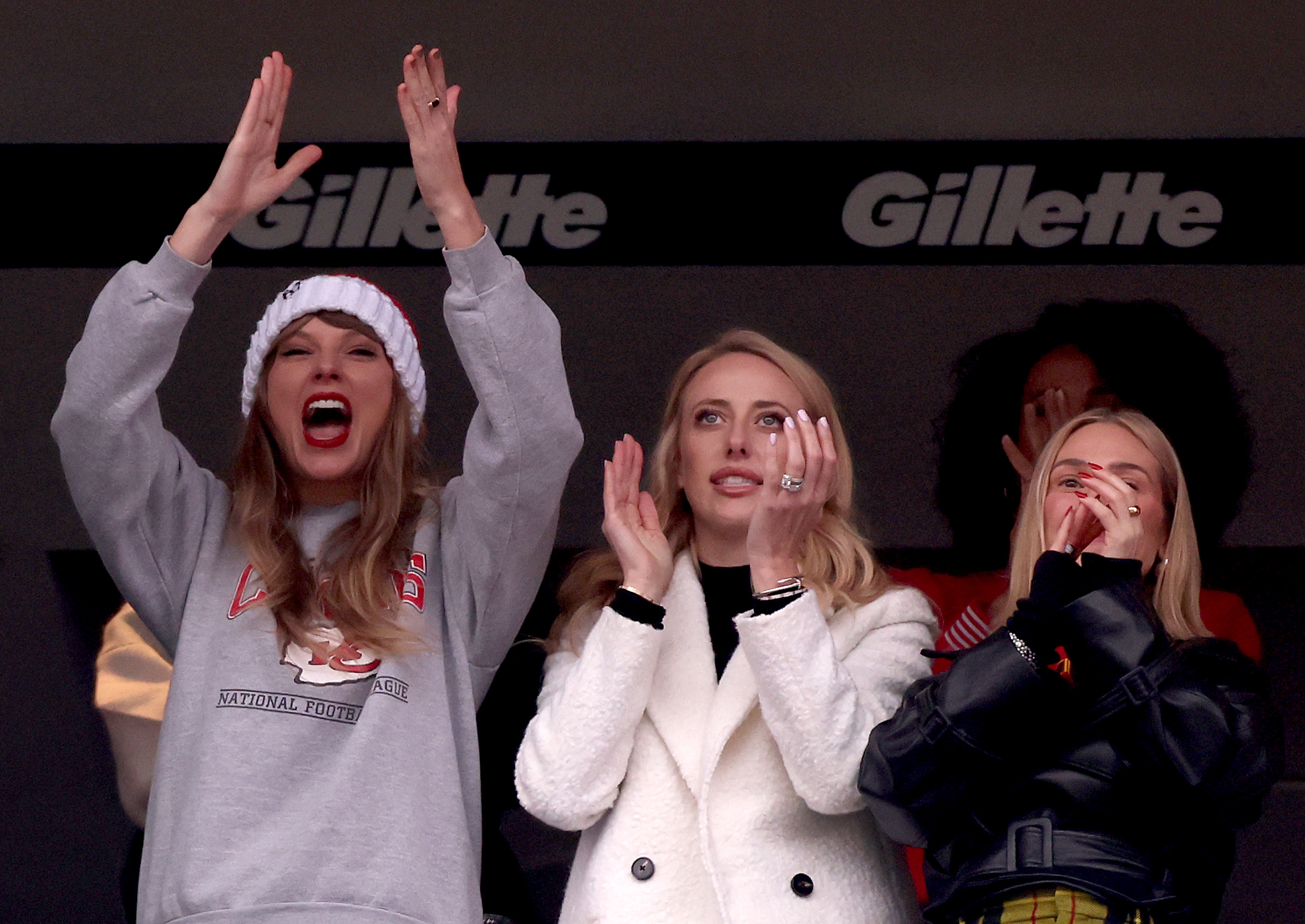 Taylor Swift and Brittany Mahomes cheering in the crowd