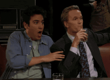 gif of josh radnor and neil patrick harris spitting out drink