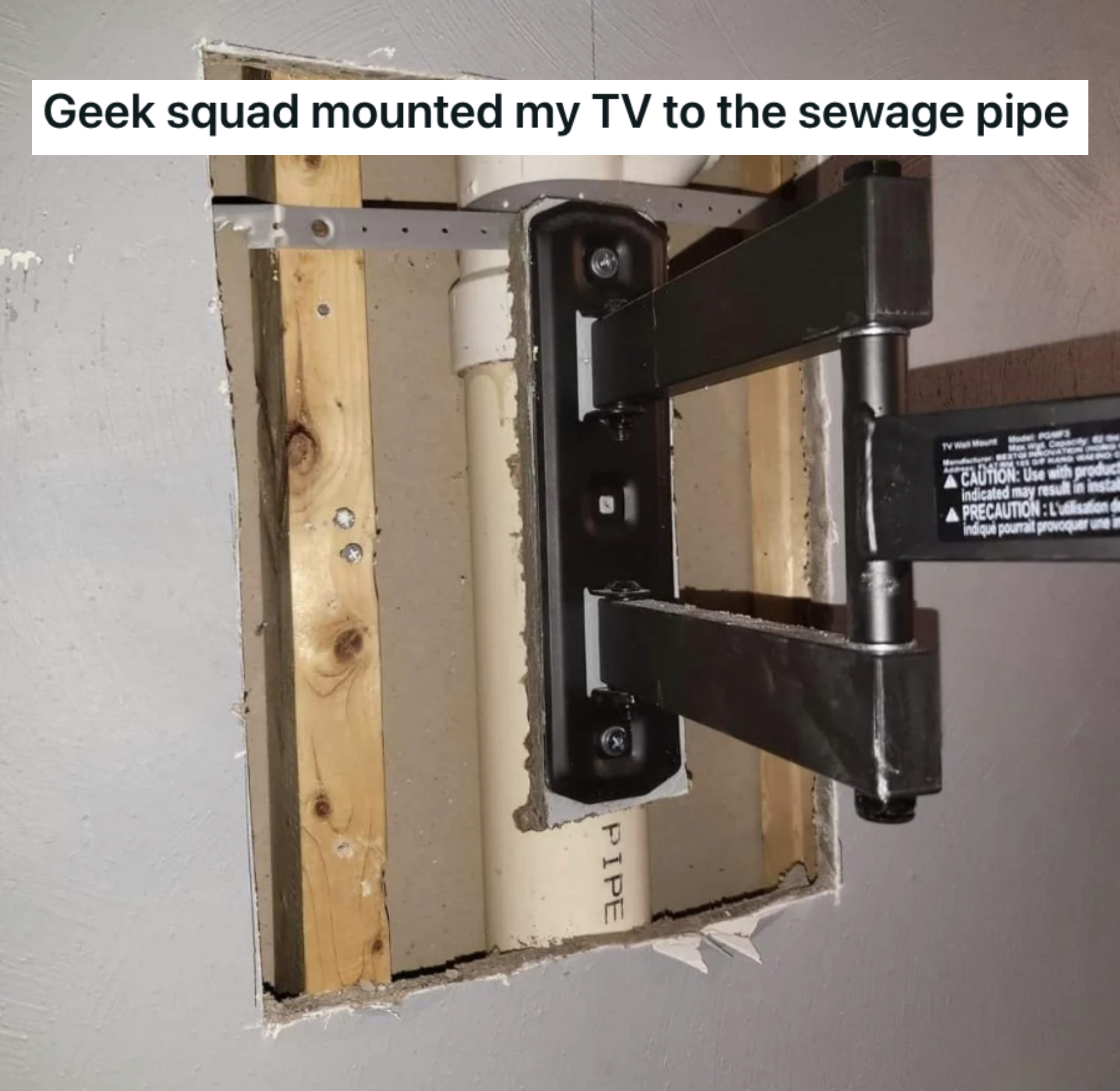 a TV mounted to a sewage pipe