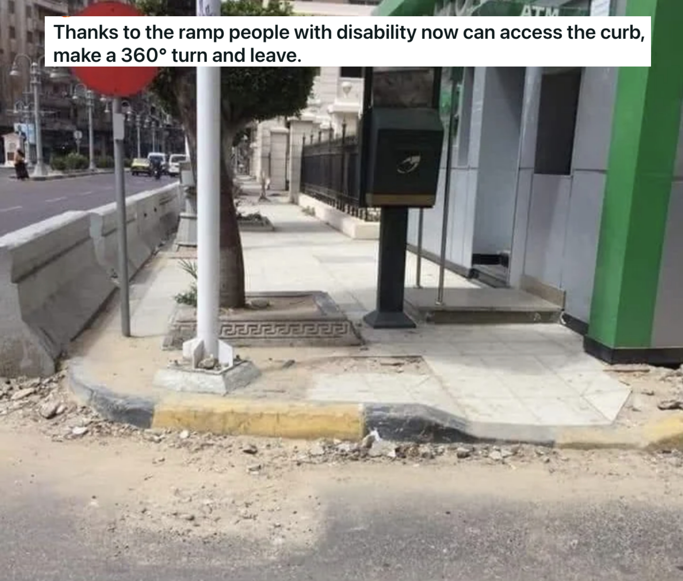 a disability ramp that leads to a step