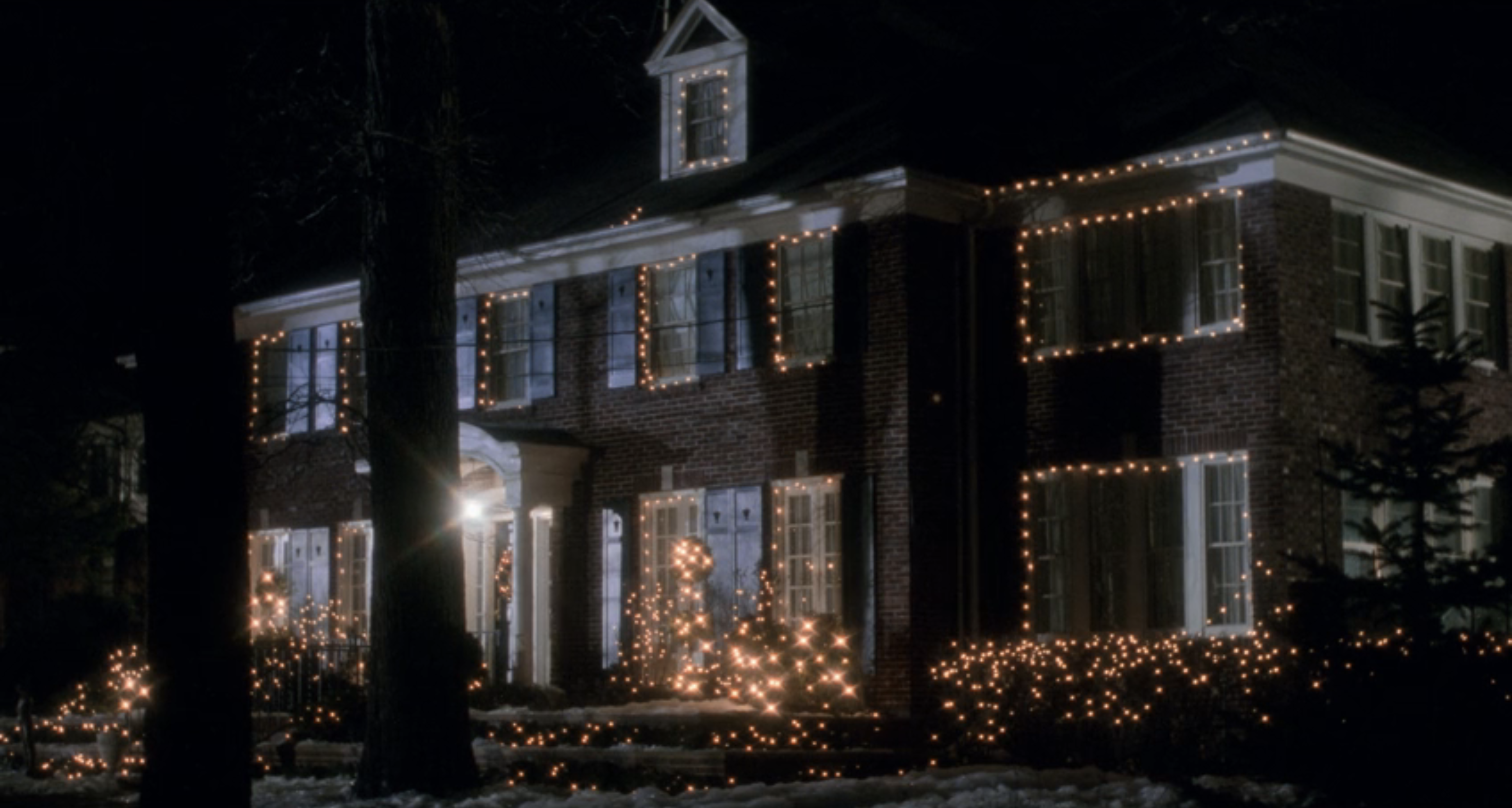 The exterior of the house with Christmas lights