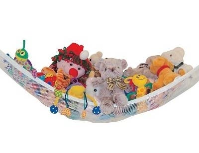 a toy hammock with stuffed animals