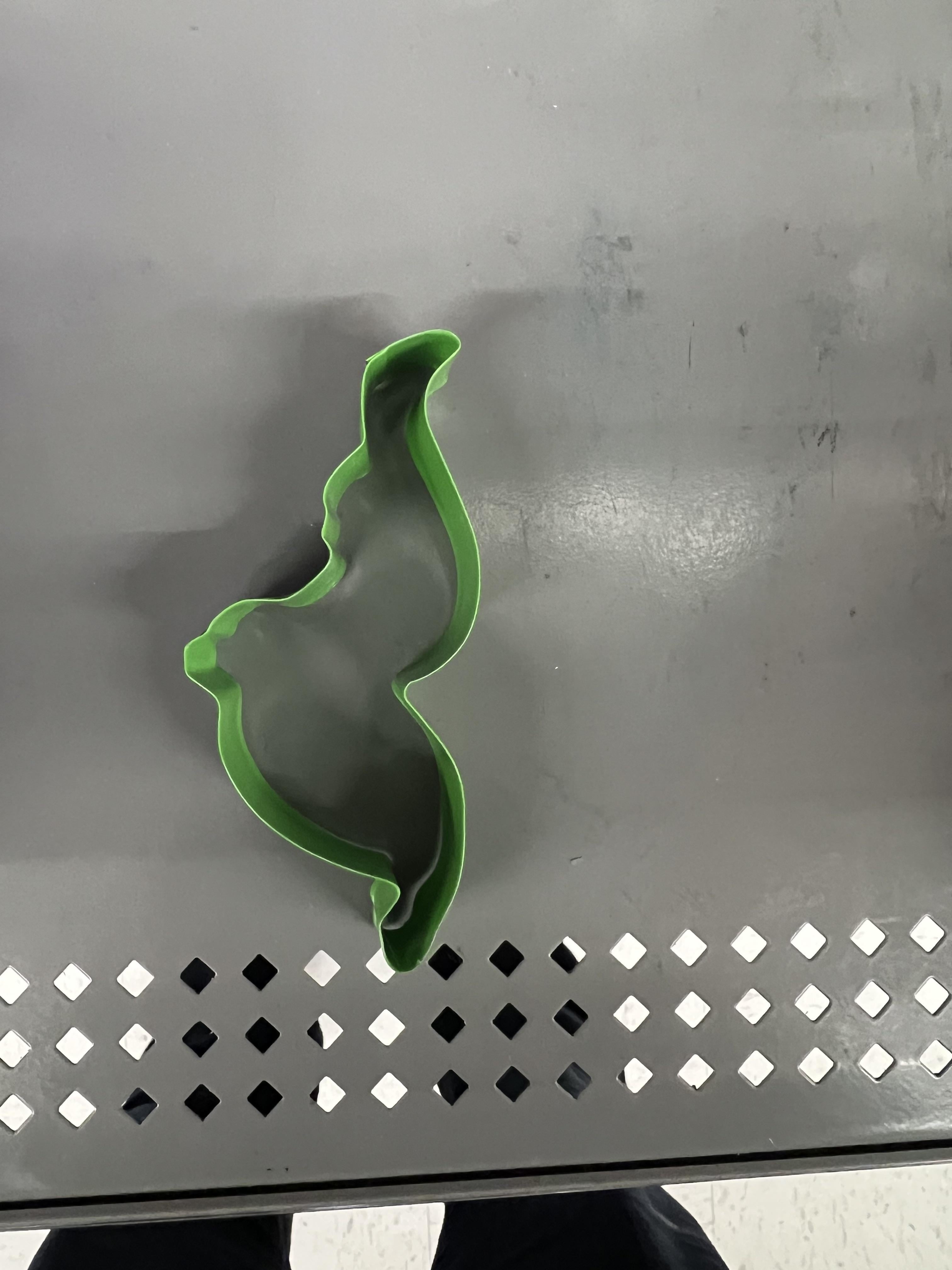 Cookie cutter that&#x27;s difficult to identify but could be side view of a pregnant person