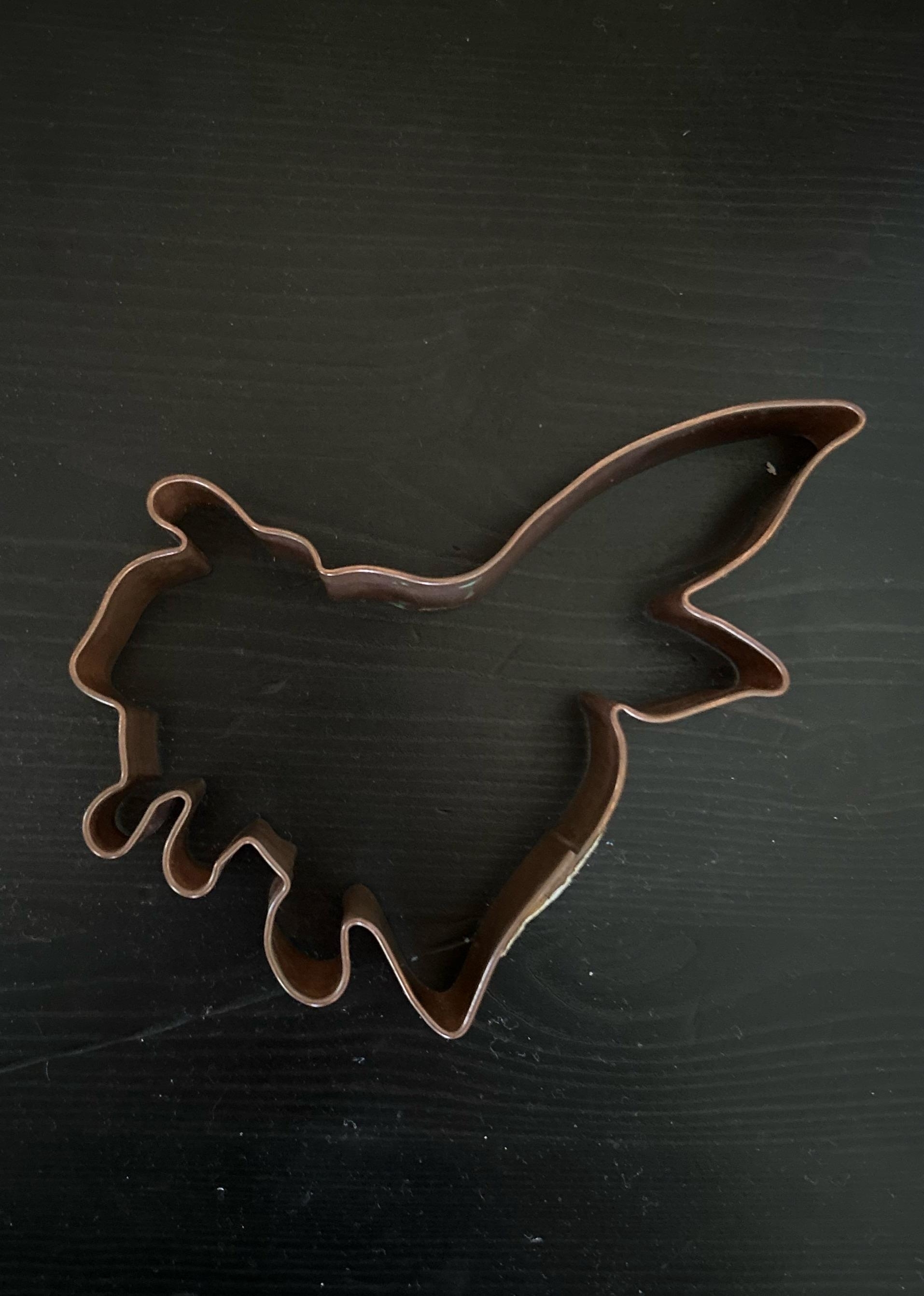 A cookie cutter that&#x27;s difficult to identify but could be a misshapen animal