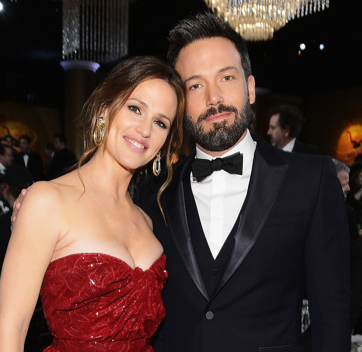 Close-up of Jennifer Garner in a strapless outfit and Ben in a tuxe