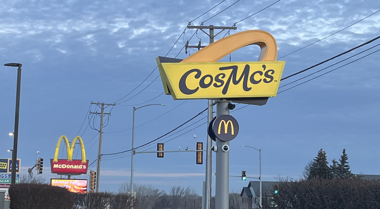 The CosMc&#x27;s sign in front of the sunrise; lightly behind it is a McDonald&#x27;s sign
