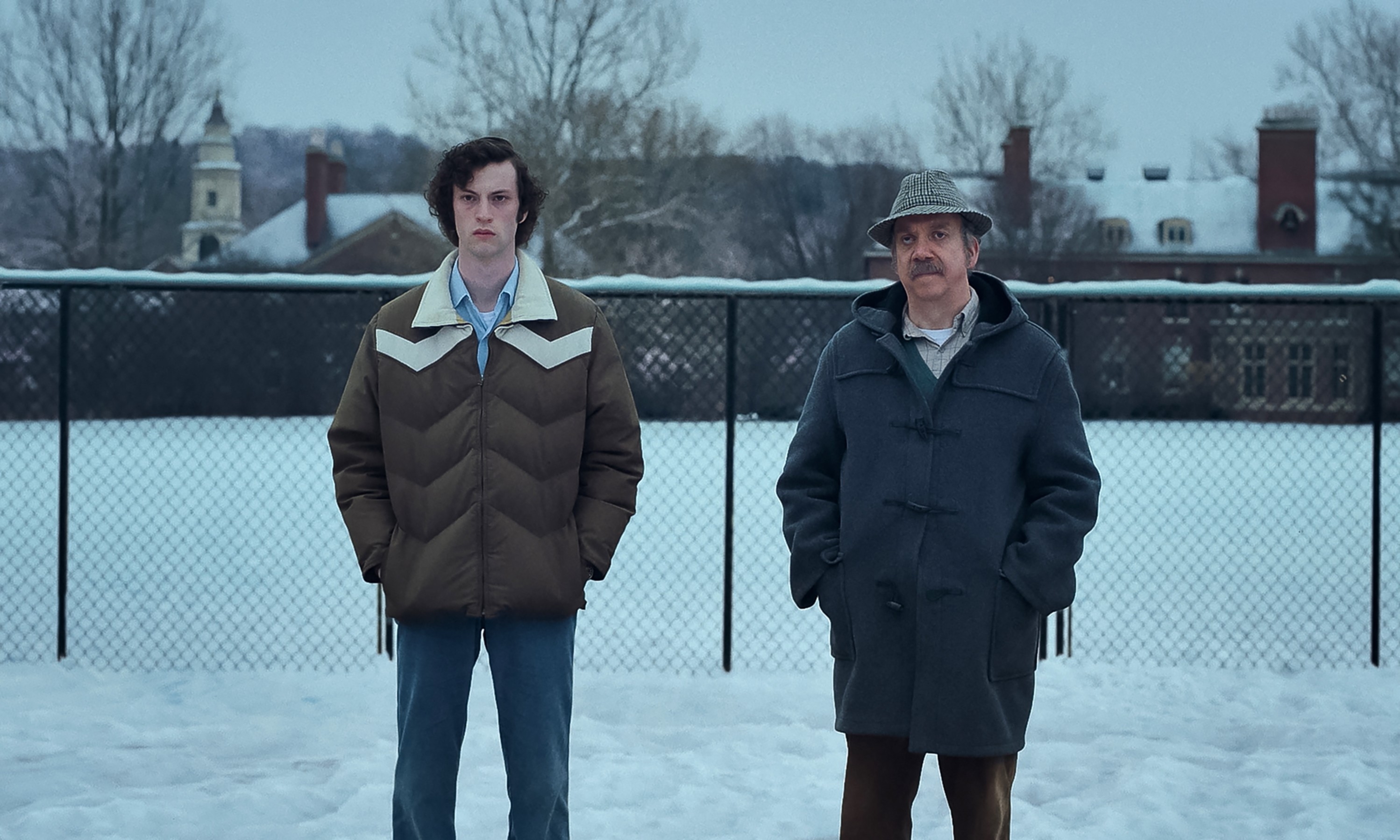 Dominic and Paul in the movie standing in a snowy field