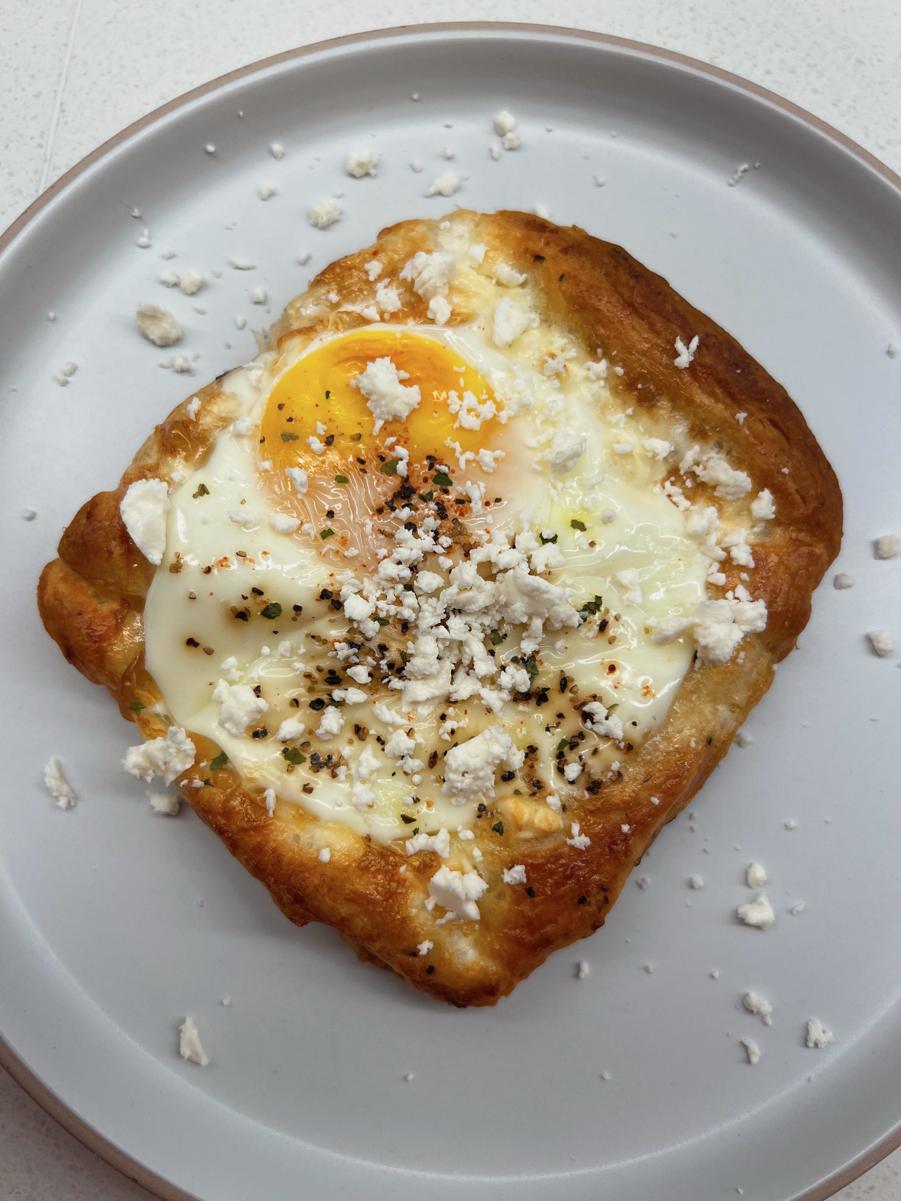 a breakfast pastry with a fried and feta