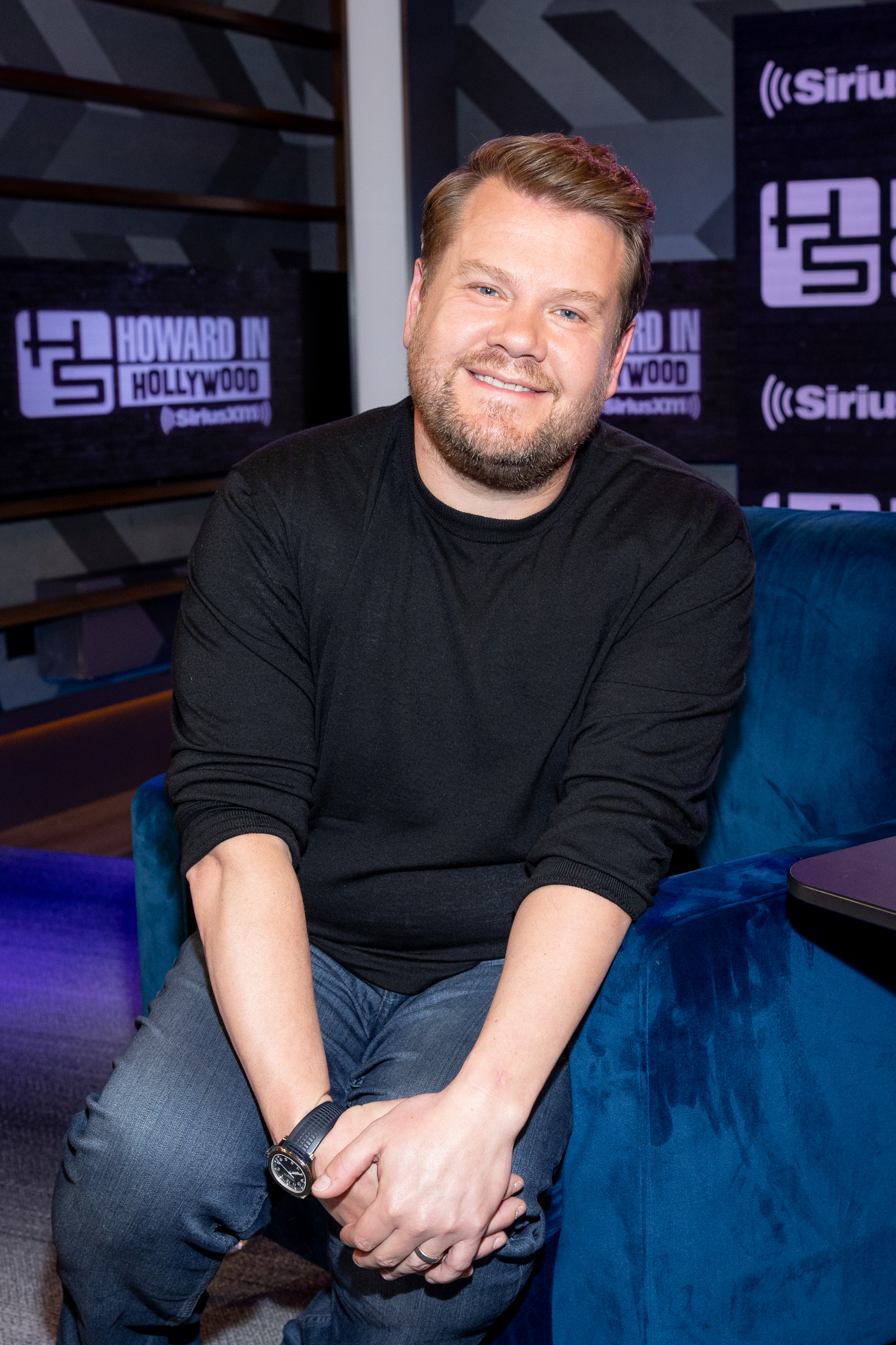 Close-up of James sitting in the SiriusXM studio and smiling