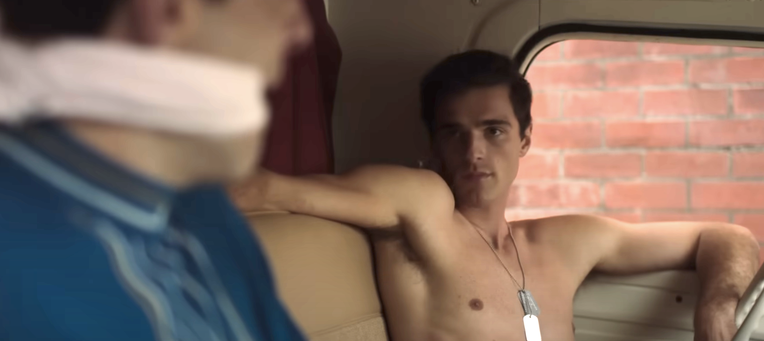 jacob&#x27;s character is shirtless in a car sitting next to someone he&#x27;s gagged
