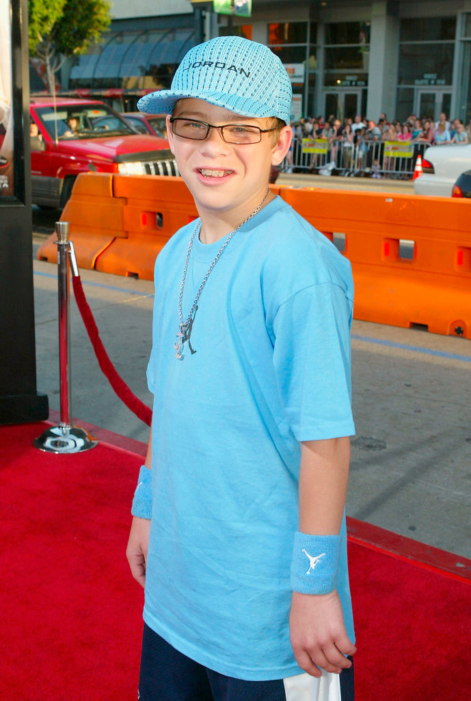 closeup of him wearing jordan gear and he has braces on the red carpet