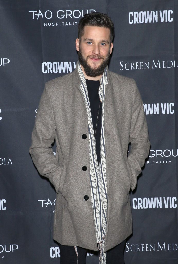 closeup of him in a peacoat at an event