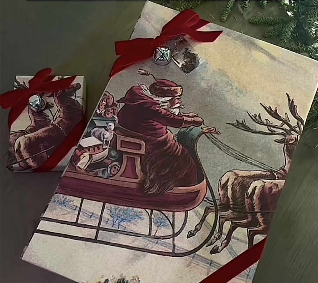 Wrapping paper showing Santa on his sled with reindeers in front
