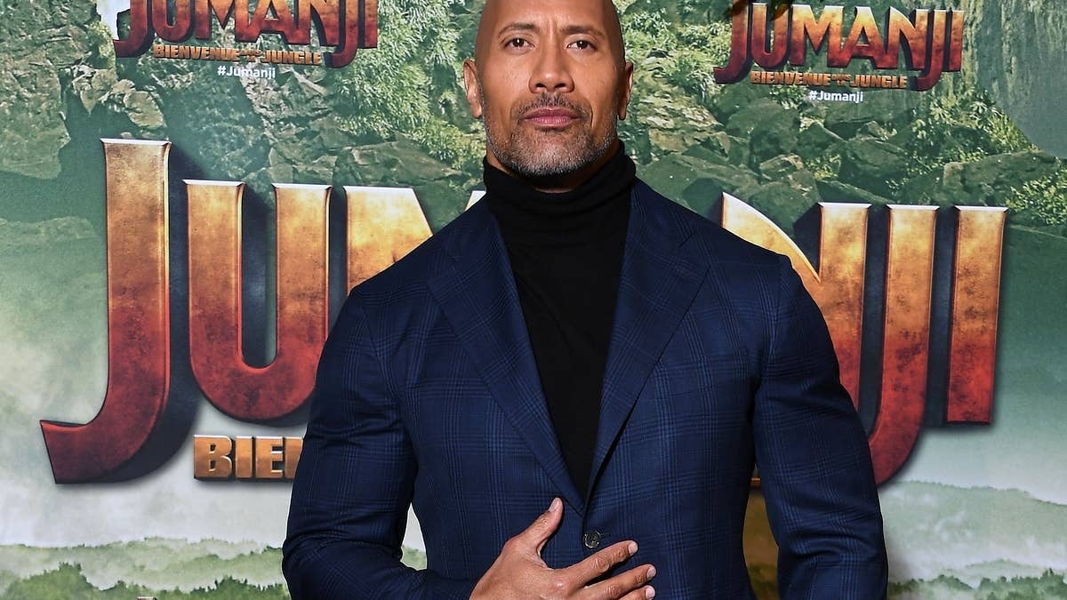 The Rock resurrected the look from his iconic fanny pack/turtleneck photo.
