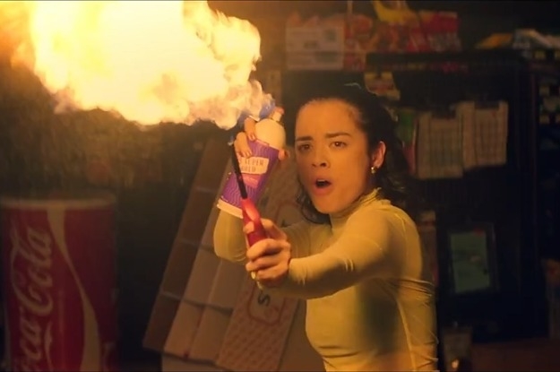 Julia Rehwald using a lighter and aerosol can to fashion a homemade flamethrower.