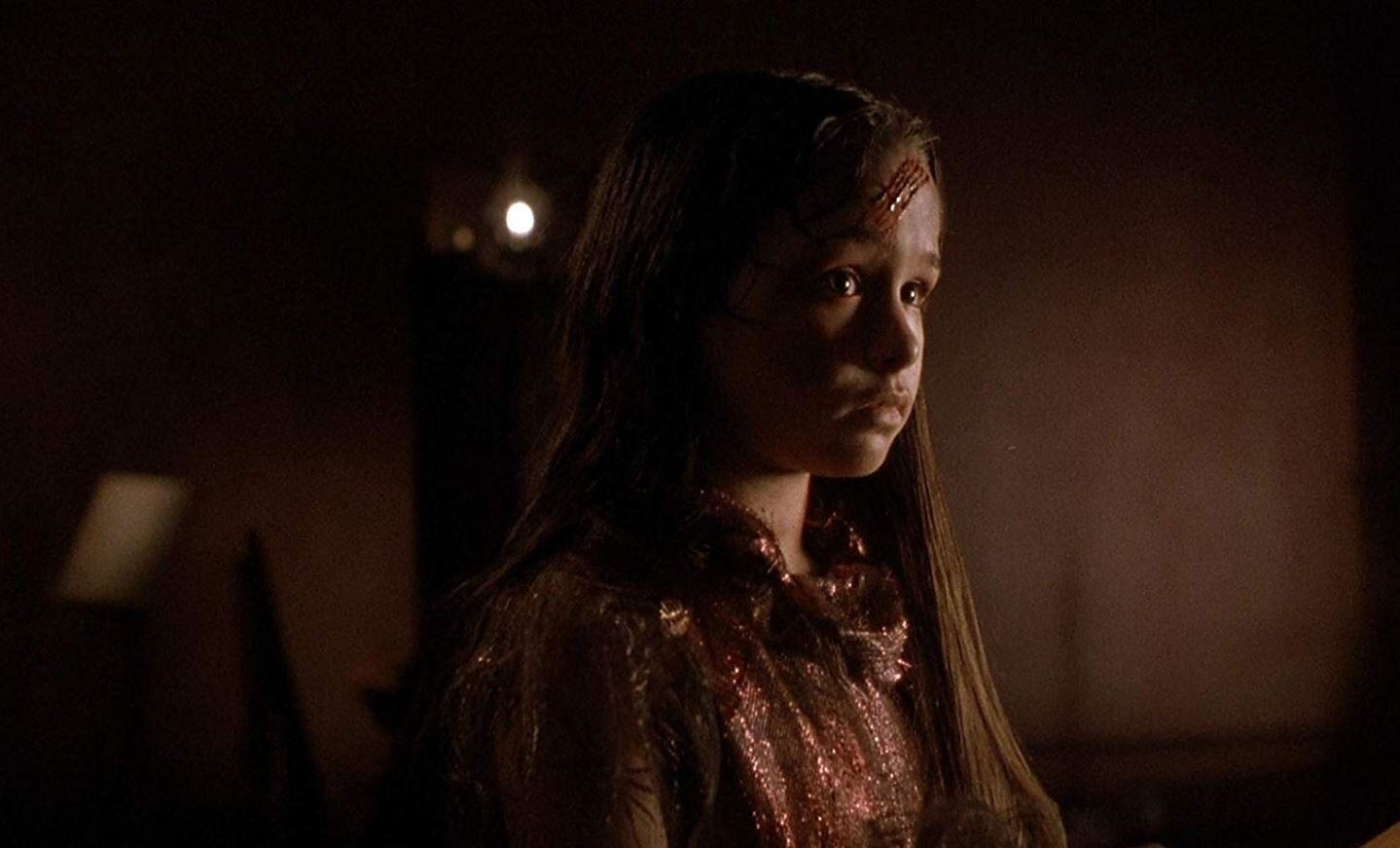 Danielle Harris with a bloody forehead.