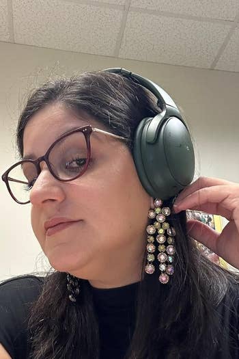 Reviewer wearing headphones