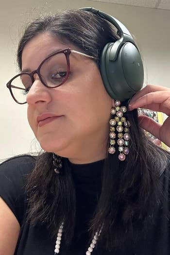 Reviewer wearing headphones