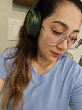 Reviewer's photo wearing headphones