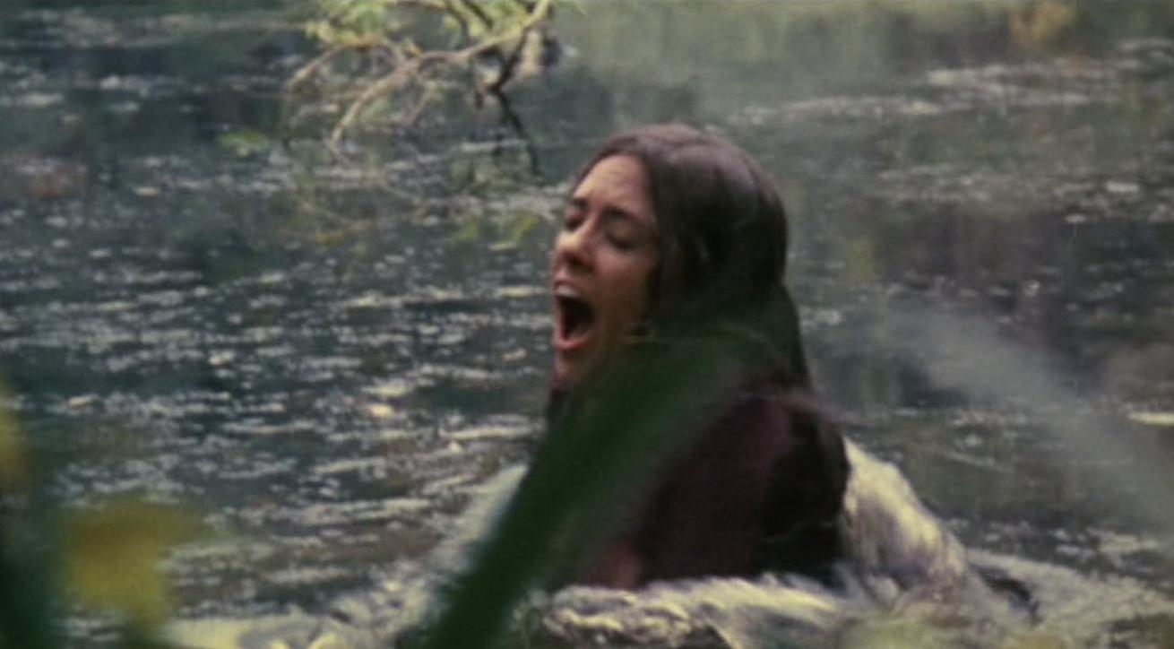 Sandra Peabody screaming in a lake.