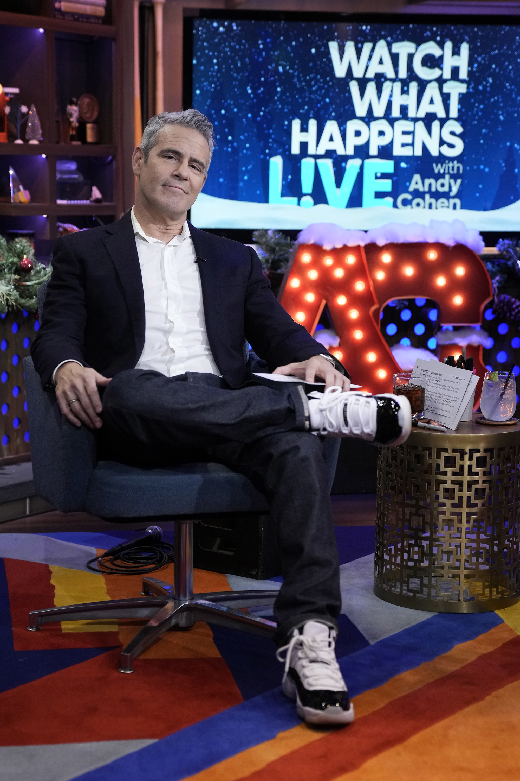 Andy seated on the set of Watch What Happens With Andy Cohen Live