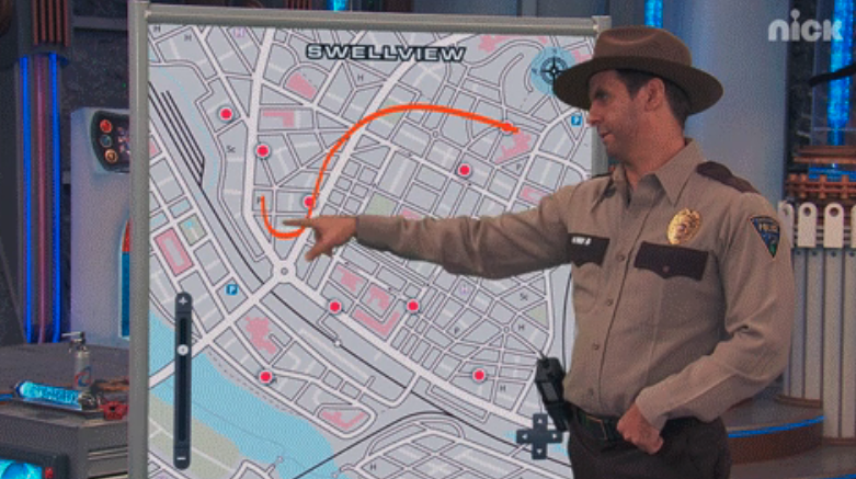 A cop pointing to a map