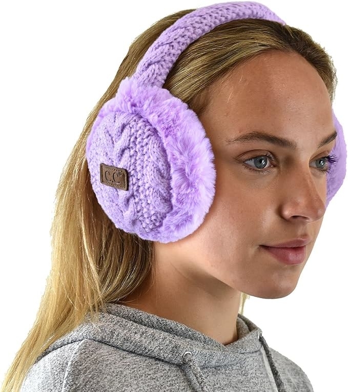 model wearing purple ear muffs