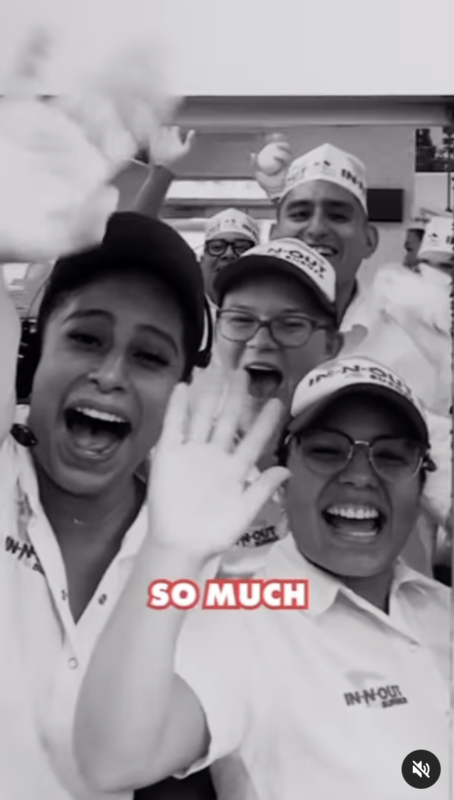 Restaurant workers smiling and waving