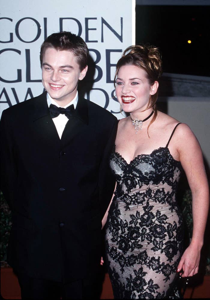The two actors smiling on the red carpet around the time of Titanic