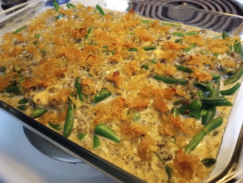 a green bean casserole cooked in a glass dish