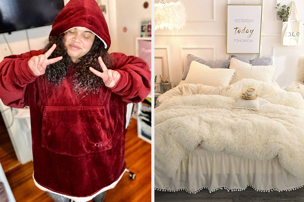 BuzzFeed editor wearing the comfy in burgundy / the off white faux fur duvet set on a bed