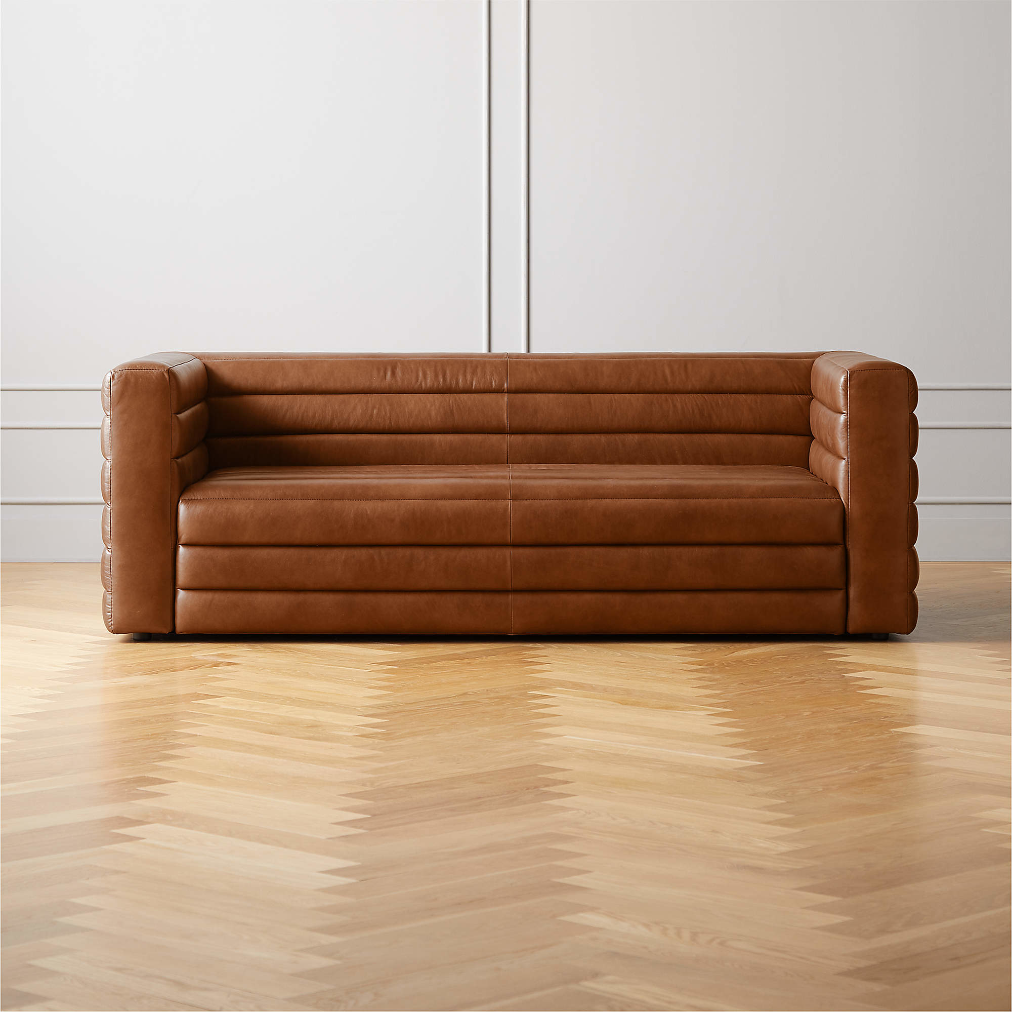 brown leather channel tufted sofa