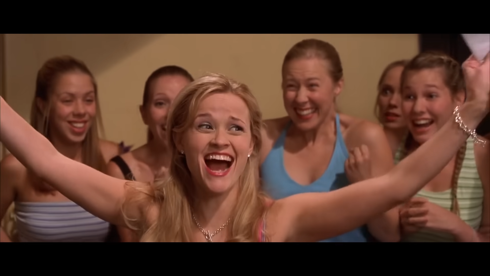 Elle Woods from "Legally Blonde" celebrating her acceptance into Harvard Law
