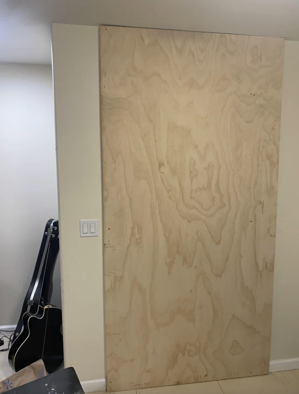 A piece of plywood blocking where a door should be