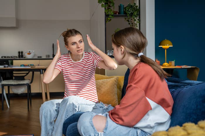 A woman yelling at her young teen daughter